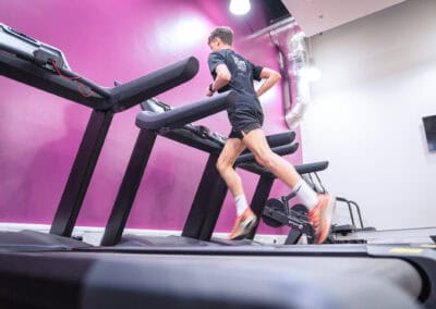 A man runs on a treadmill at the Club Cheadle Hulme gym at Cheadle Hulme High School.